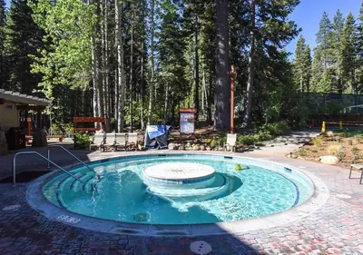 a small pool with a fountain in the middle at Northstar Resort Condo for 8 Free Shuttle in Truckee