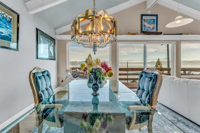 a dining room with a glass table and chairs at Big Blue Views Walk 2 Lake in Tahoe Vista