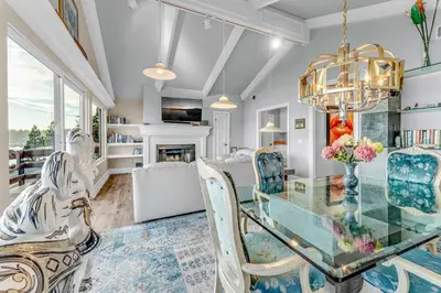 a dining room with a glass table and chairs at Big Blue Views Walk 2 Lake in Tahoe Vista