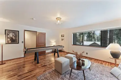 a living room with a pool table in it at The Pinecrest Retreat- 10 mins to NorthStar! Hot Tub, Large Deck, Views, and Games in Tahoe Vista