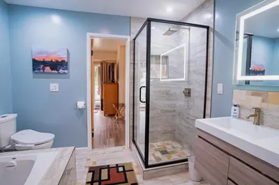 a bathroom with a shower and a toilet and a sink at Tahoe Waterfront Condo with Boat Dock in South Lake Tahoe
