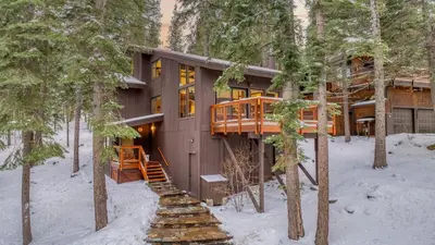 a house in the woods in the snow at In Northstar Ski Resort Game Room Family-Friendly Dakine Haus by AvantStay in Truckee