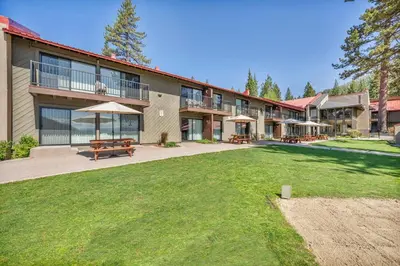 a large building with a lawn in front of it at Charming Studio Deluxe w/kitchen #215 at Donner Lake Village in Truckee