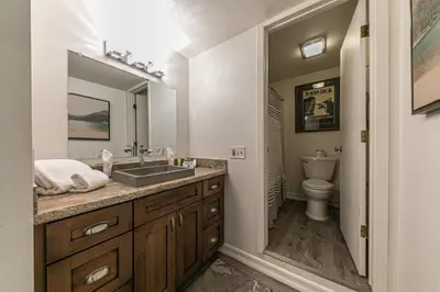 a bathroom with a sink and a toilet at Charming Studio Deluxe w/Full Kitchen #115 at Donner Lake Village in Truckee