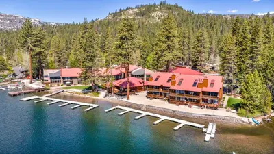 an aerial view of a resort with a dock at Partial Lake View Stunning Deluxe King Studio #125 at Donner Lake Village in Truckee
