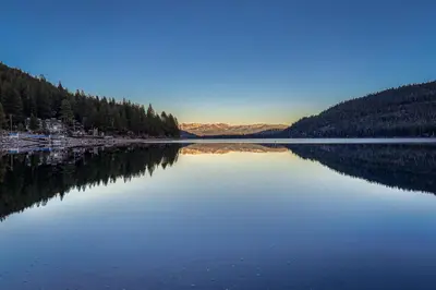 a large body of water with trees on the shore at Cozy Studio 1st Floor #132 at Donner Lake Village in Truckee