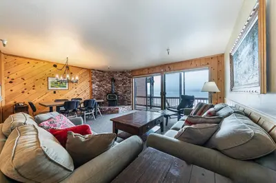 a living room with a couch and a table at Comfortable Townhouse w/Lake View #154 at Donner Lake Village in Truckee