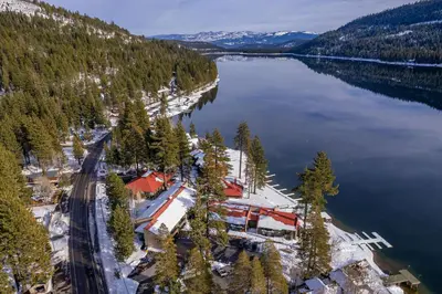 an aerial view of a resort on the shore of a lake at Cozy Studio w/Kitchenette and Balcony #212 at Donner Lake Village in Truckee