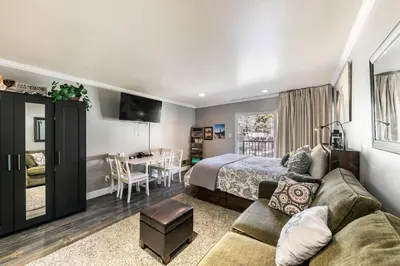 a hotel room with a bed and a dining room at King Deluxe Studio 2nd Floor Unit 216 Bldg B in Truckee