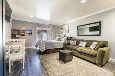 a living room with a bed and a couch at King Deluxe Studio 2nd Floor Unit 216 Bldg B in Truckee