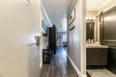 a hallway with a sink and a refrigerator at King Deluxe Studio 2nd Floor Unit 216 Bldg B in Truckee