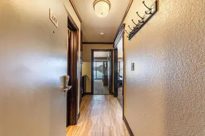 a hallway with a door leading into a room at Spacious Condo w/Lake View #247 at Donner Lake Village in Truckee