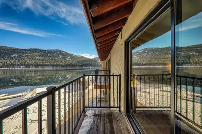 a balcony of a house with a view of a lake at Charming Deluxe Studio w/Lake View #246 at Donner Lake Village in Truckee