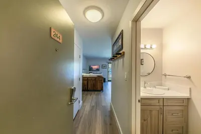 a bathroom with a sink and a mirror at Striking Studio w/Lake View #244 at Donner Lake Village in Truckee