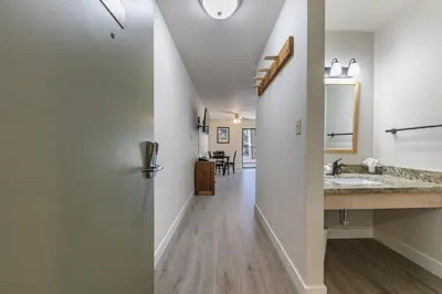 a hallway leading to a bathroom with a sink at King Studio 2nd Floor #234 at Donner Lake Village in Truckee