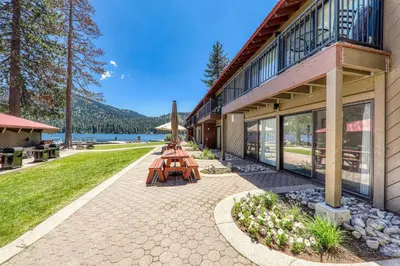 a group of picnic tables outside of a building at Modern Studio Deluxe #231 at Donner Lake Village in Truckee