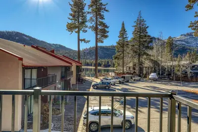 a view from a balcony of a parking lot at Cozy Studio w/ Partial Lake view #223 at Donner Lake Village in Truckee