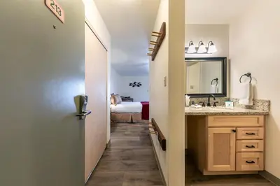a bathroom with a sink and a mirror at Studio w/Kitchen 2nd Floor #213 at Donner Lake Village in Truckee