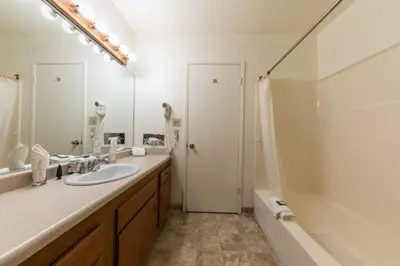 a bathroom with a sink and a shower at Spacious 1BR Condo w/ Lake View #136 at Donner Lake Village in Truckee
