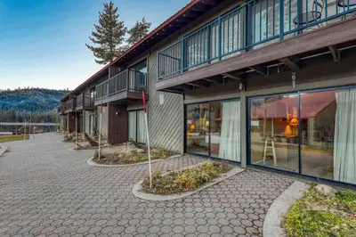 a building with a courtyard with plants in front of it at Inviting King Deluxe 1 BR Condo W/Lake view #141 at Donner Lake Village in Truckee