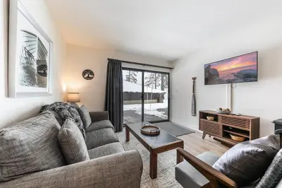 a living room with a couch and a table at Inviting King Deluxe 1 BR Condo W/Lake view #141 at Donner Lake Village in Truckee
