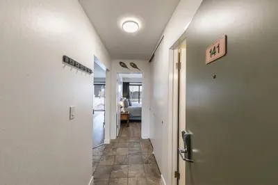 a hallway with a door leading to a room at Inviting King Deluxe 1 BR Condo W/Lake view #141 at Donner Lake Village in Truckee