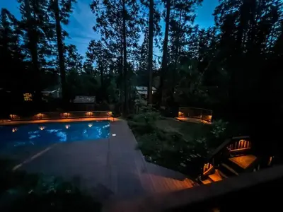 a swimming pool in a yard at night at Twain Harte Lake, pool/hot tub, by skiing/Yosemite in Twain Harte