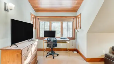 a home office with a desk and a television at Minutes to Ski Resorts 5min Walk to Lake Sunnyside Ward Creek by AvantStay in Tahoe City