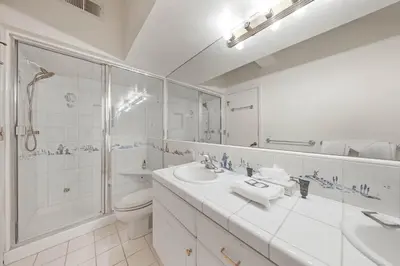 a bathroom with a toilet and a sink and a shower at Palisades Tahoe Lodge Rentals Studio Loft #306 in Olympic Valley