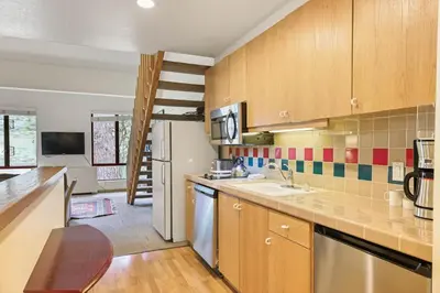 a kitchen with a sink and a counter top at Palisades Tahoe Lodge Rentals Studio Loft #345 in Olympic Valley