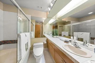 a bathroom with a toilet and a sink and a tub at Palisades Tahoe Lodge Rentals Studio Loft #331 in Olympic Valley