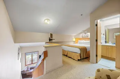 a bedroom with a bed and a sink in a room at Studio Loft #348 in Olympic Valley