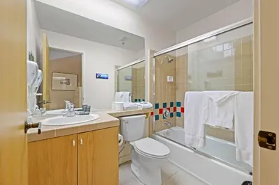 a bathroom with a toilet and a sink and a shower at Studio Loft #348 in Olympic Valley