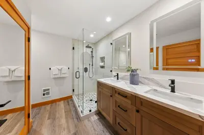 a bathroom with a sink and a shower at Palisades Tahoe Lodge Rentals Premium Two Bedroom #700 in Olympic Valley