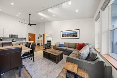 a living room with a couch and a table at Palisades Tahoe Lodge Rentals Premium Two Bedroom #805 in Olympic Valley