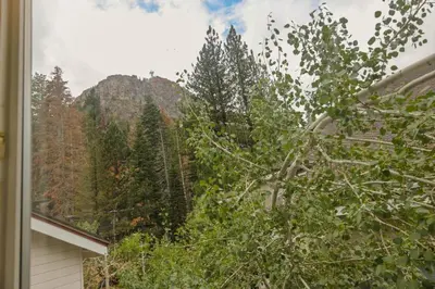 a mountain view from the window of a house at Palisades Tahoe Lodge Rentals Two Bedroom #422 in Olympic Valley