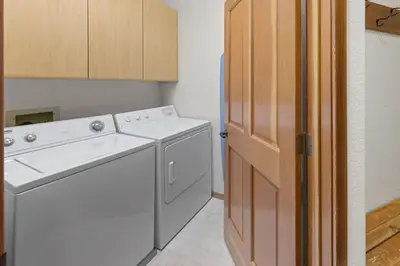 a white washer and dryer in a small kitchen at Palisades Tahoe Lodge Rentals Two Bedroom #521 in Olympic Valley