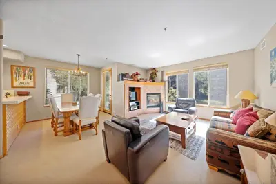 a living room with a couch and a table at Palisades Tahoe Lodge Rentals Two Bedroom #512 in Olympic Valley