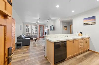 an open kitchen and living room in a home at Palisades Tahoe Lodge Rentals Two Bedroom #705 in Olympic Valley