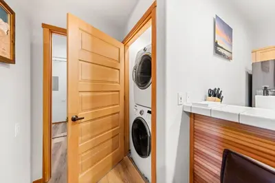 a laundry room with a washer and dryer at Palisades Tahoe Lodge Rentals Two Bedroom #705 in Olympic Valley