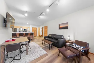 a living room with a couch and a table at Palisades Tahoe Lodge Rentals Two Bedroom #705 in Olympic Valley