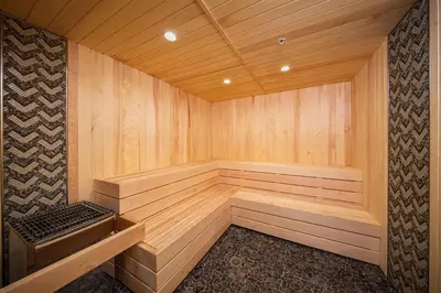 a large wooden sauna with a bench in it at Palisades Tahoe Lodge Rentals Two Bedroom #804 in Olympic Valley