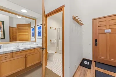 a bathroom with a toilet and a sink at Palisades Tahoe Lodge Rentals Two Bedroom #800 in Olympic Valley