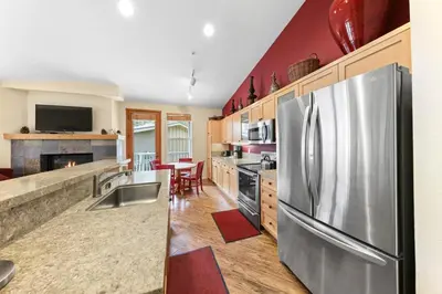 a kitchen with a stainless steel refrigerator at Palisades Tahoe Lodge Rentals Two Bedroom #813 in Olympic Valley