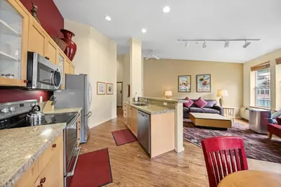 an open kitchen and living room in a apartment at Palisades Tahoe Lodge Rentals Two Bedroom #813 in Olympic Valley