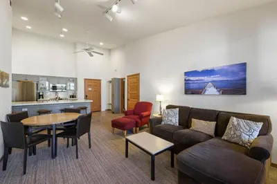 a living room with a couch and a table at Two Bedroom #801 in Olympic Valley