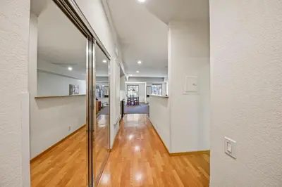 a hallway of a house with a glass door at Palisades Tahoe Lodge Rentals Studio #104 in Olympic Valley
