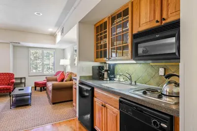 a kitchen with a sink and a stove at Palisades Tahoe Lodge Rentals Studio #203 in Olympic Valley