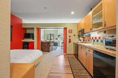 a kitchen with a bed and a sink in a room at Palisades Tahoe Lodge Rentals Studio #151 in Olympic Valley