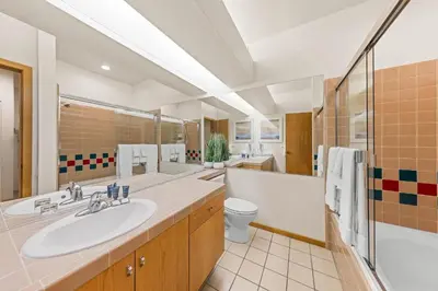 a bathroom with a sink and a tub and a toilet at Palisades Tahoe Lodge Rentals Studio #152 in Olympic Valley